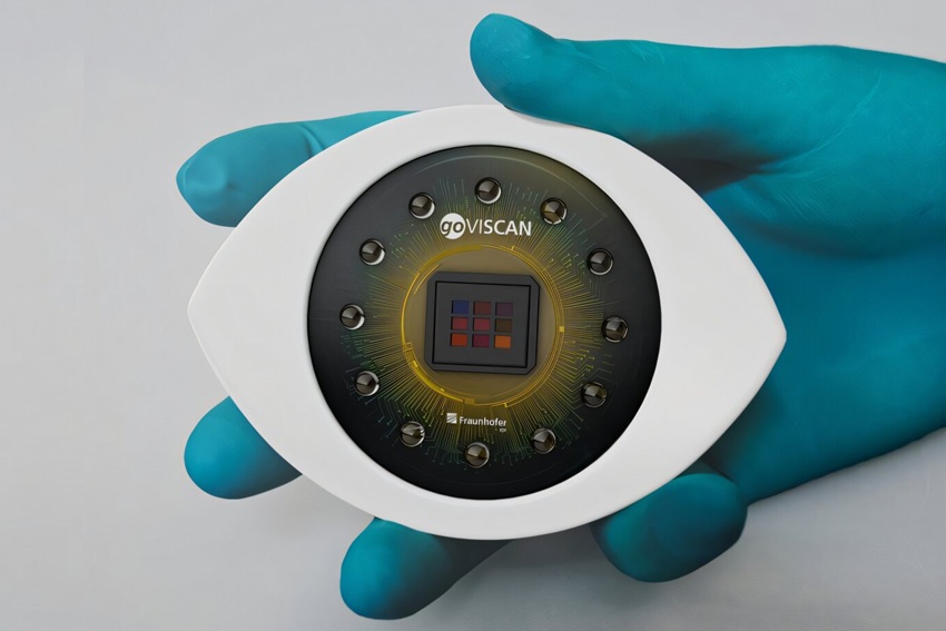 Imagen: El sensor de signos vitales goVISCAN: en el centro está la cámara multiespectral con un conjunto de microlentes de 3 x 3 que captura las bandas espectrales. Los LED están dispuestos en círculo a su alrededor para iluminar la escena de medición. (Crédito de la imagen: Fraunhofer IOF)