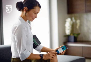 The Philips upper arm blood pressure monitor and watch, connected to an app
