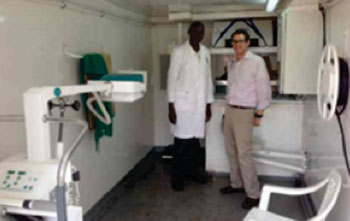 Image: The specially designed mobile X-ray truck reaches patients in underserved areas of Kenya. Peter Otunga, chief of radiography for AMPATH, and radiologist Marc Kohli, MD, inside the truck (Photo courtesy of RSNA News). Image: The specially designed mobile X-ray truck reaches patients in underserved areas of Kenya. Peter Otunga, chief of radiography for AMPATH, and radiologist Marc Kohli, MD, inside the truck (Photo courtesy of RSNA News).