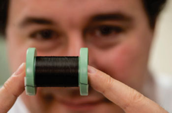 Image: Prof. Matteo Pasquali holding a spool of pure carbon nanotube fiber (Photo courtesy of Jeff Witlow/ Rice University).