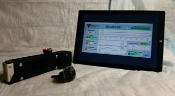 Image: MouthLab prototype of a hand-held, portable device that quickly picks up and reports patient vital signs, with potential to replace bulky hospital and ambulance vital sign monitors and to provide at-home personal monitoring (Photo courtesy of Yuankui Zhu: Johns Hopkins Medicine).