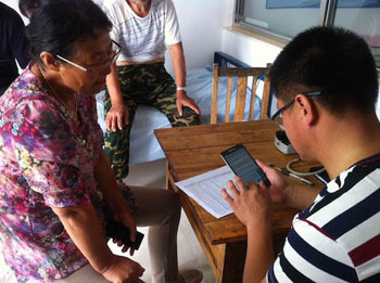 Image: A health worker collects information via the VAI app (Photo courtesy of the University of Melbourne).