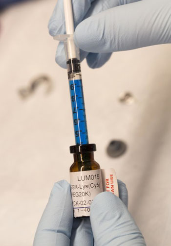 Image: The injectable agent, a blue liquid called LUM015, can be used to identify cancerous tissue in human patients without adverse effects. (Photo courtesy of Shawn Rocco/ Duke Medicine).