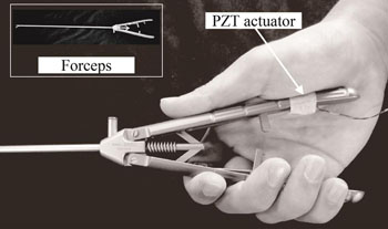 Image: The PZT Actuator attached to standard surgical forceps (Photo courtesy Yuichi Kurita, Hiroshima University).