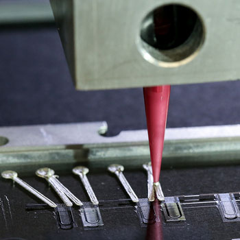 Image: Close up of 3D printer printing heart-on-a-chip MPD (Photo courtesy of Harvard University).