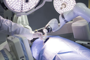 Image: A robotic assistant helps position interventional needles (Photo courtesy of Fraunhofer IPA).
