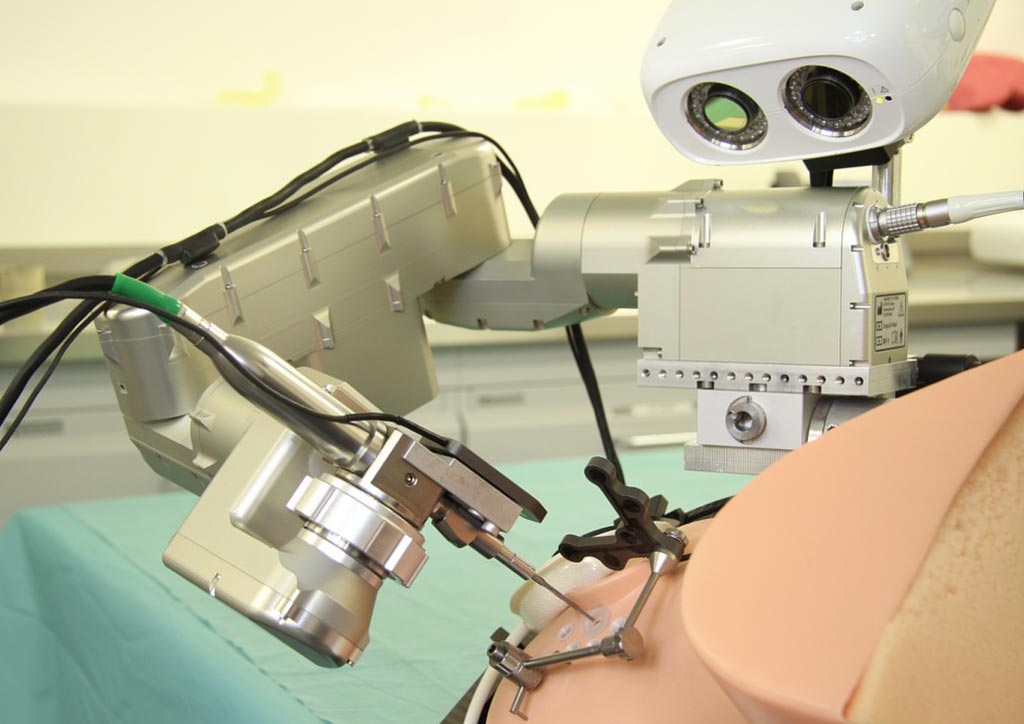 Image: The RCI robot aligned with entry trajectory on the phantom head (Photo courtesy of the University of Bern).