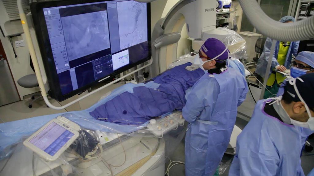 Image: Dr. Aaron Fischman performing a bariatric embolization procedure (Photo courtesy of Mount Sinai Hospital).