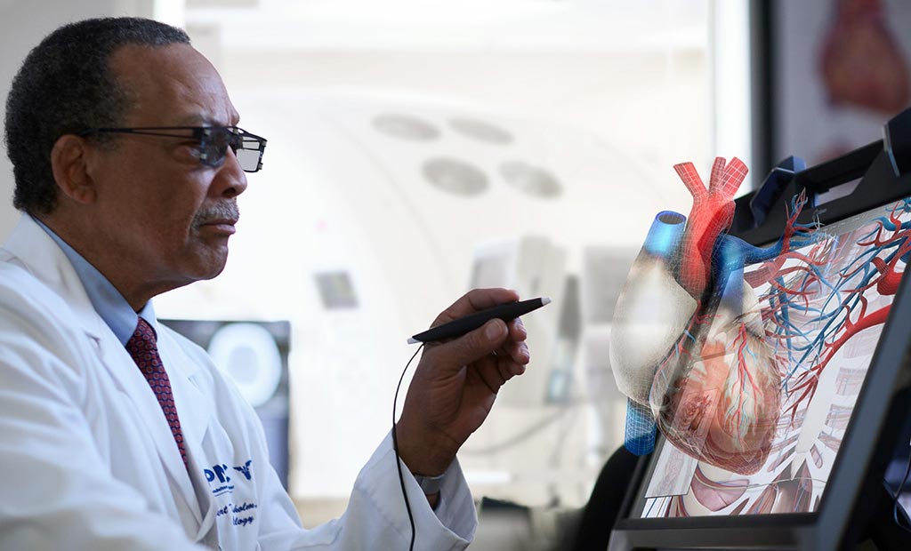 Image: VR glasses and an electronic scribe help manipulate a holographic heart (Photo courtesy of EchoPixel).