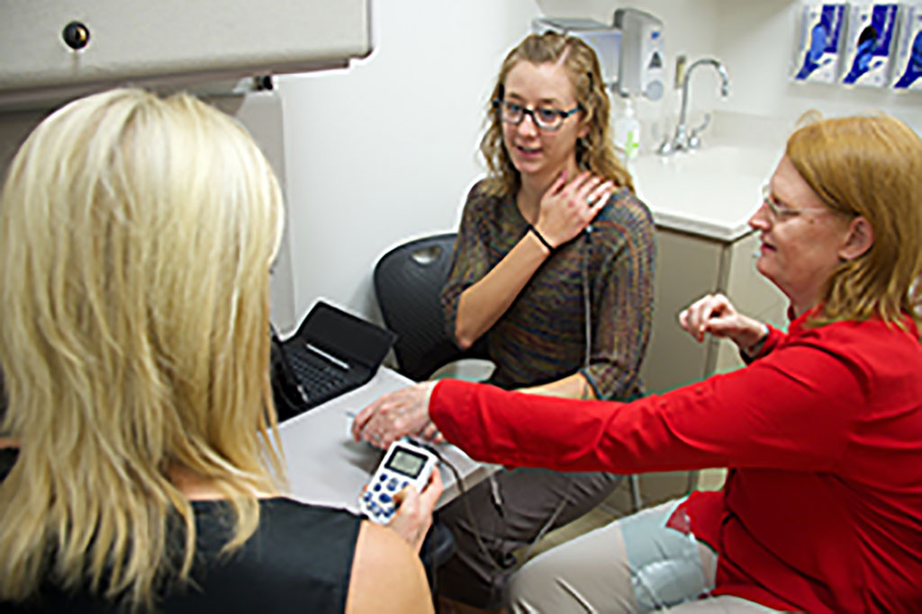Image: Dr. Kathleen Sluka administering TENS therapy (Photo courtesy of University of Iowa)