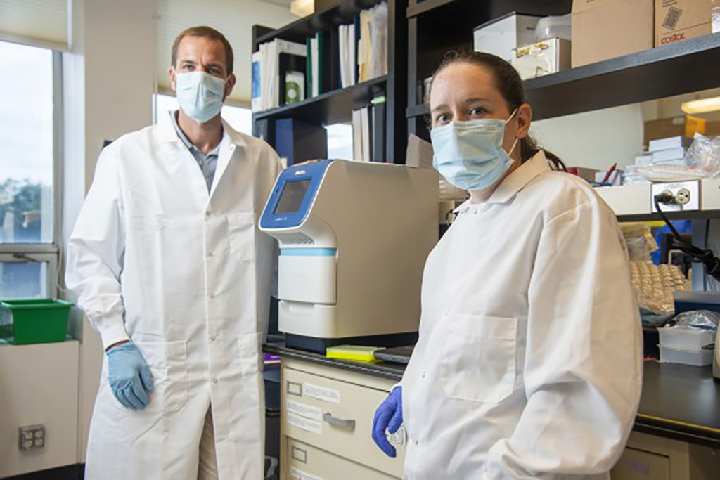 Image: Jason Botten and Emily Bruce in their research lab in the University of Vermont’s Larner College of Medicine (Photo courtesy of University of Vermont)