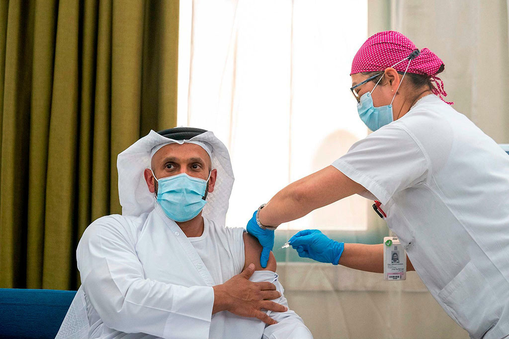 Image: H.E. Sheikh Abdullah bin Mohammed Al Hamed, Chairman of Department of Health, Abu Dhabi, being administered the world’s first clinical Phase III trial of inactivated vaccine to combat COVID-19 (Photo courtesy of AETOSWire).