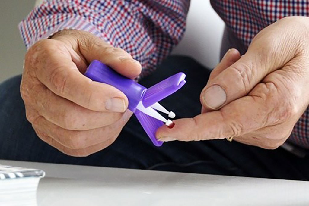 Image: A study participant collects blood at home using a Mitra device with VAMS technology from Neoteryx (Photo courtesy of Neoteryx)