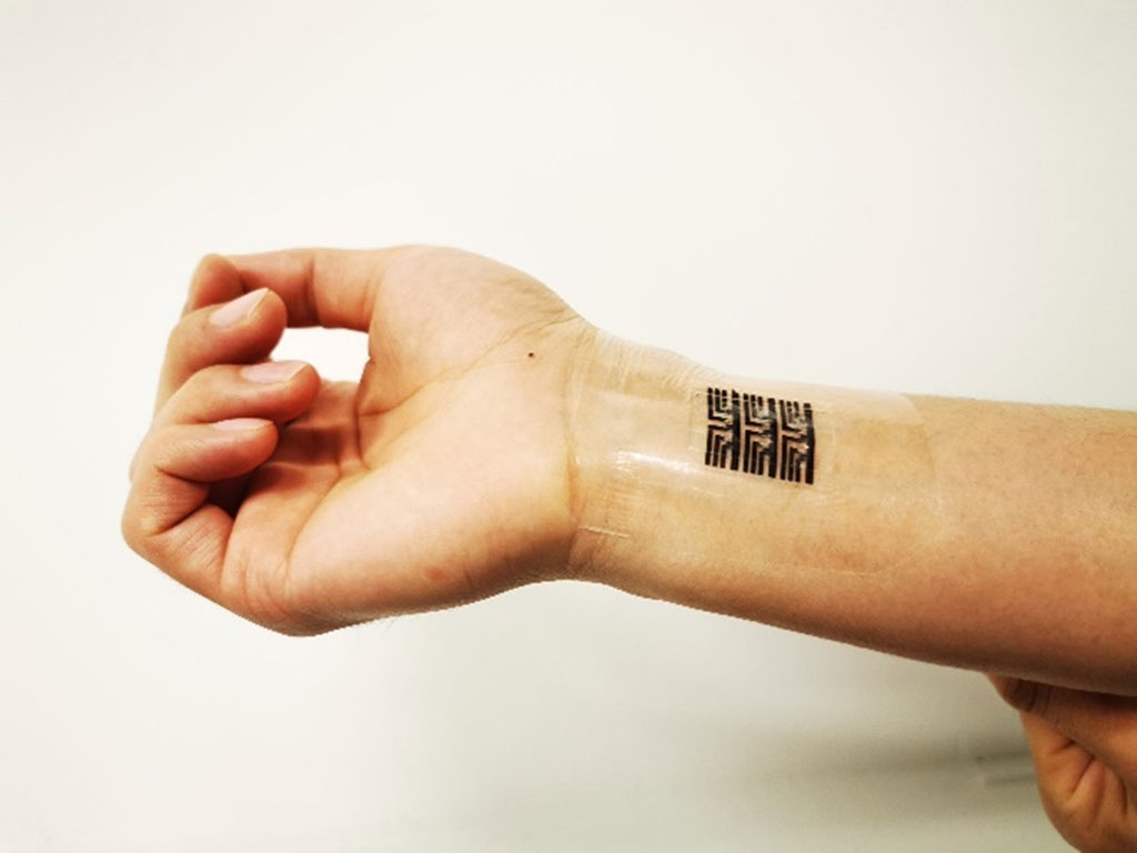 Image: Stretchy computing device feels like skin but analyzes health data with brain-mimicking AI (Photo courtesy of The University of Chicago)