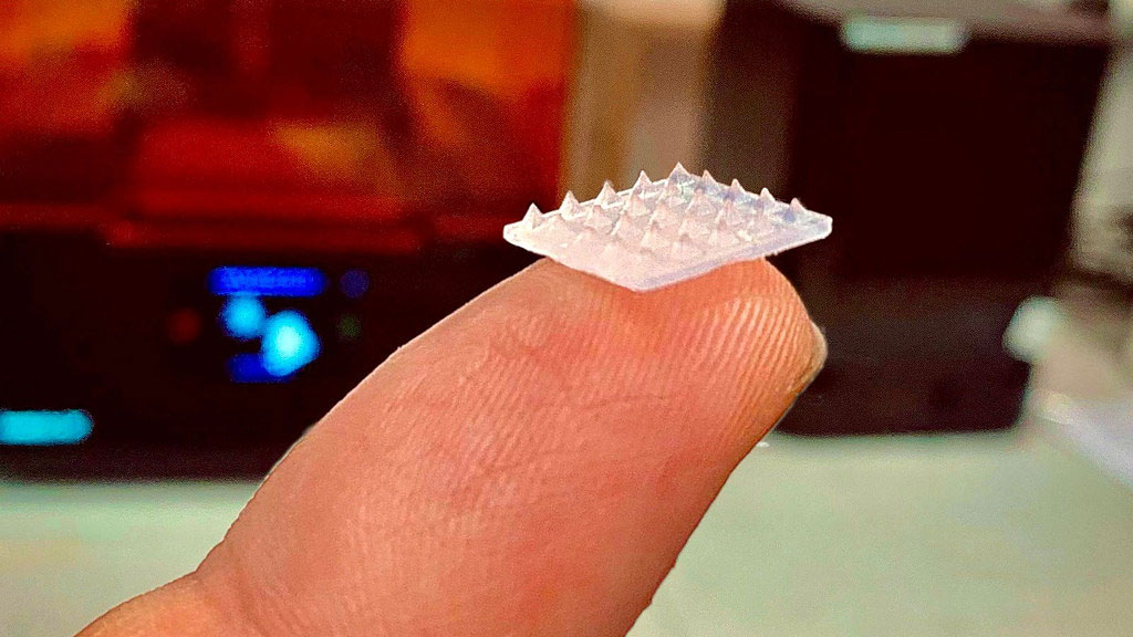 Image: The patch is smaller than a pound coin and is covered in barely visible microneedles (Photo courtesy of University of Bath)