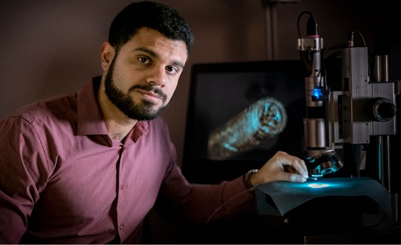 Image: Ángel Enríquez, CEO of Emboa Medical Inc., showing the novel microstructured catheter design (Photo courtesy of Vincent Walter/Purdue University)