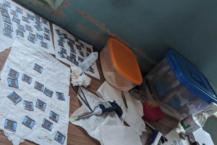 Image: The paper-based devices at a study site (Photo courtesy of Abraham Badu-Tawiah/OSU)