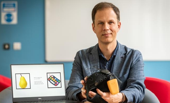 Image: Dr. George Stothart with the Fastball EEG system (Photo courtesy of University of Bath)