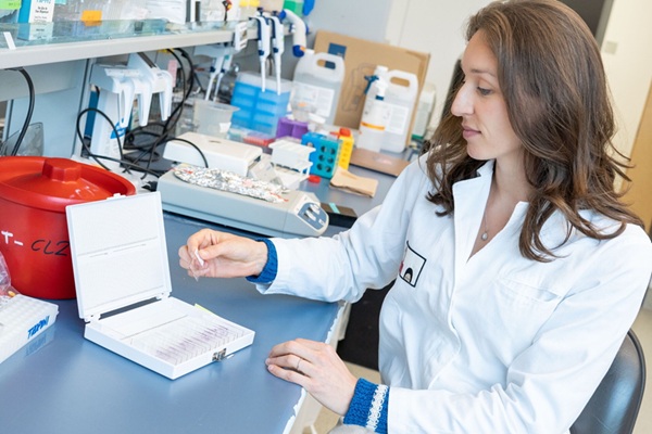 Image: Dr. Carolina Tropini, senior author of the study in which researchers engineered gut bacteria that dim their fluorescent glow in the presence of illness (Photo courtesy of UBC)