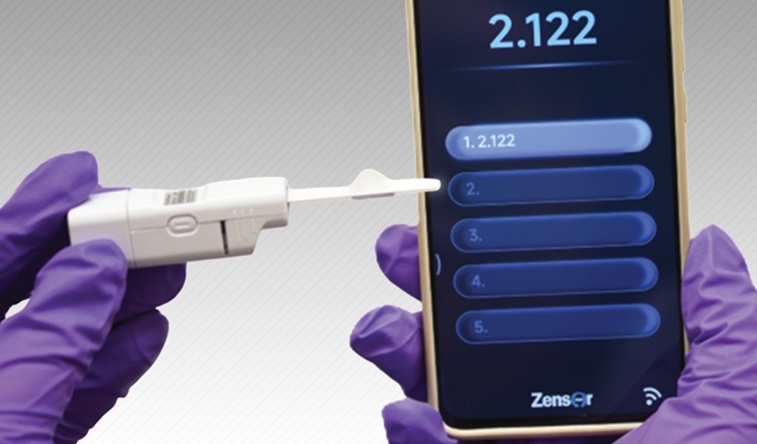 Image: A smartphone application displays a glucose concentration that was measured using the new sensor (Photo courtesy of Chuchu Chen and Yonghao Fu)