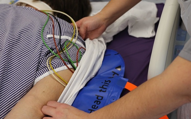 Image: The BathMat is positioned beneath the sheet under the patient’s upper body to lift and reposition them with ease (Photo courtesy of the University of Bath)