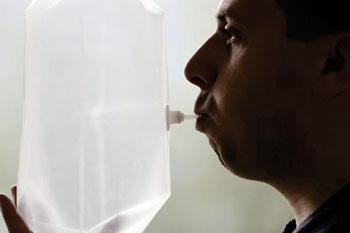 Image: Exhaling into a tedlar bag for volatile organic compound analysis (Photo courtesy of the Information and Scientific News Service (SINC).
