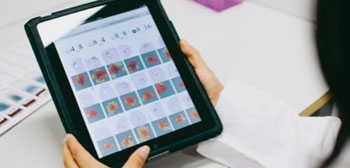 Image: The parasite detection method is based on computer vision algorithms similar to those used in facial recognition systems combined with visualization of only the diagnostically most relevant areas. Tablet computers can be utilized in viewing the images (Photo courtesy of the Institute for Molecular Medicine).
