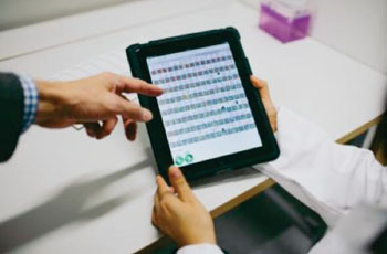 Image: Tablet computer used for visualization of diagnostically relevant RBCs. (Photo courtesy of Ari Hallami / FIMM).