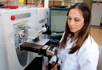 Image: Co-Lead author of the study, Livia Eberlin, PhD, operating a DESI-MS system (Photo courtesy of Purdue News Service).
