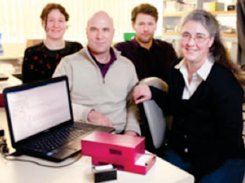 Image: The Freedom4 PCR unit for field use was developed by (L-R) Ms. Christy Rand, Mr. Chris Mason, Dr. Chris Rawle, and Dr. Jo-Ann Stanton (Photo courtesy of the University of Otago).