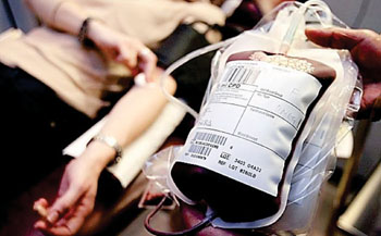 Image: Collecting blood for transfusion (Photo courtesy of Toby Melville).