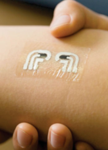Image: Bioengineers have tested a flexible and easy to wear temporary tattoo that both extracts and measures the level of glucose in the fluid in between skin cells (Photo courtesy of the University of California, San Diego).