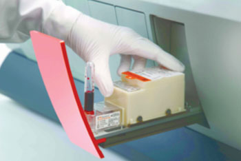 Image: Loading the T2Candida panel into the Stat drawer of the T2Dx instrument (Photo courtesy of T2 Biosystems).