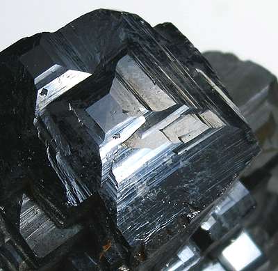 Image: An example of magnetite with sharp, lustrous, jet-black crystals (Photo courtesy of Wikimedia Commons).