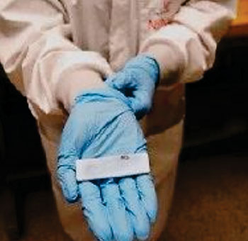 Image: Nanofiber membranes inside a paper-porous test strip form the basis of blood clot test (Photo courtesy of the University of Cincinnati).