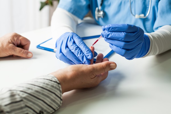 Image: A quick finger prick and few drops of blood on a card could make Alzheimer’s testing more accessible (Photo courtesy of Shutterstock)