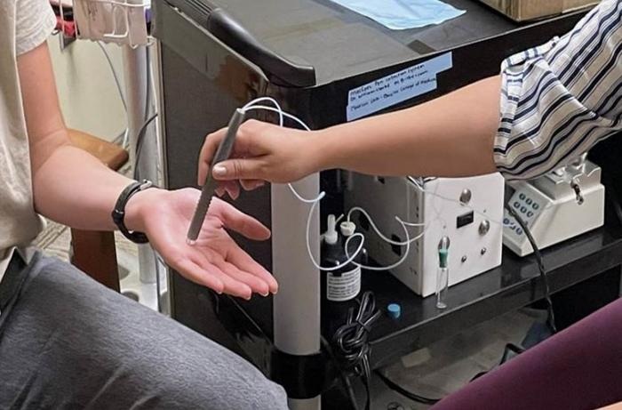 Image: A pen-like tool collects molecules from the skin that can be screened for opioids (Photo courtesy of William Clarke/Johns Hopkins)