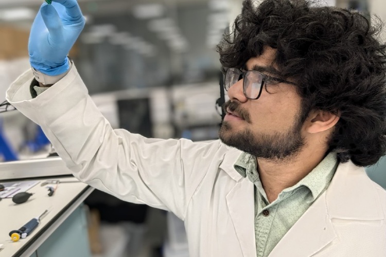Image: Researcher Sudhaunsh Deshpande holding the molecularly imprinted polymer-based biosensor (Photo courtesy of University of Liverpool)