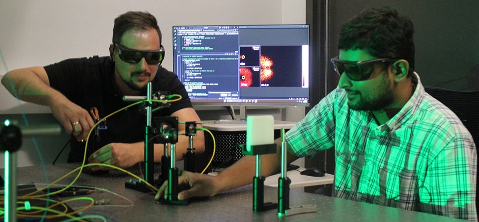 Image: Florian Willomitzer (left) and Madabhushi Balaji align their Synthetic Wavelength Imaging lab bench prototype to image non-melanoma skin cancer (Photo courtesy of Parker Liu/University of Arizona)