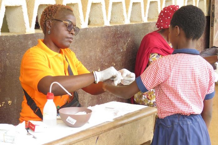 Image: A health worker from the Mfou District Hospital collects a blood sample for the study (Photo courtesy of Sandrine Nsango, PhD)