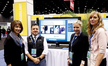 Image: Researchers Betsy L. Sussman, MD, Matthew D. LeComte, PhD, Kristen K. DeStigter, MD, and Mary Streeter, R.T. presenting a new obstetrical ultrasound technique for resource-poor areas (Photo courtesy of RSNA).