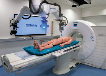 Image: The robotic Virtobot system performs various tasks together with a CT scanner to produce high-resolution 3D surface documentation, and enable CT-guided postmortem tissue sampling. (Photo courtesy of RSNA).