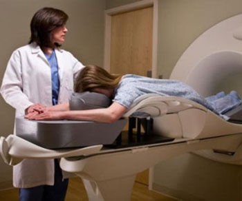 Image: A woman undergoing a breast MRI. A new study suggests the position in which a woman is placed during her pre-surgical breast MRI could influence the scan’s accuracy (Photo courtesy of Brigham and Women\'s Hospital / NHV).