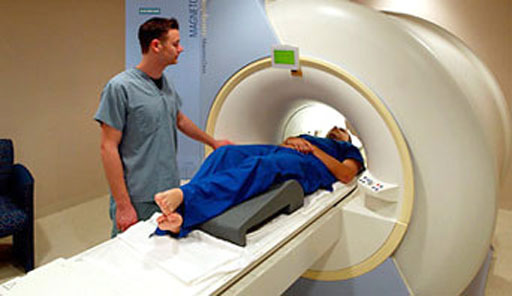 Image: A patient undergoing an MRI scan (Photo courtesy of the NHS, UK).