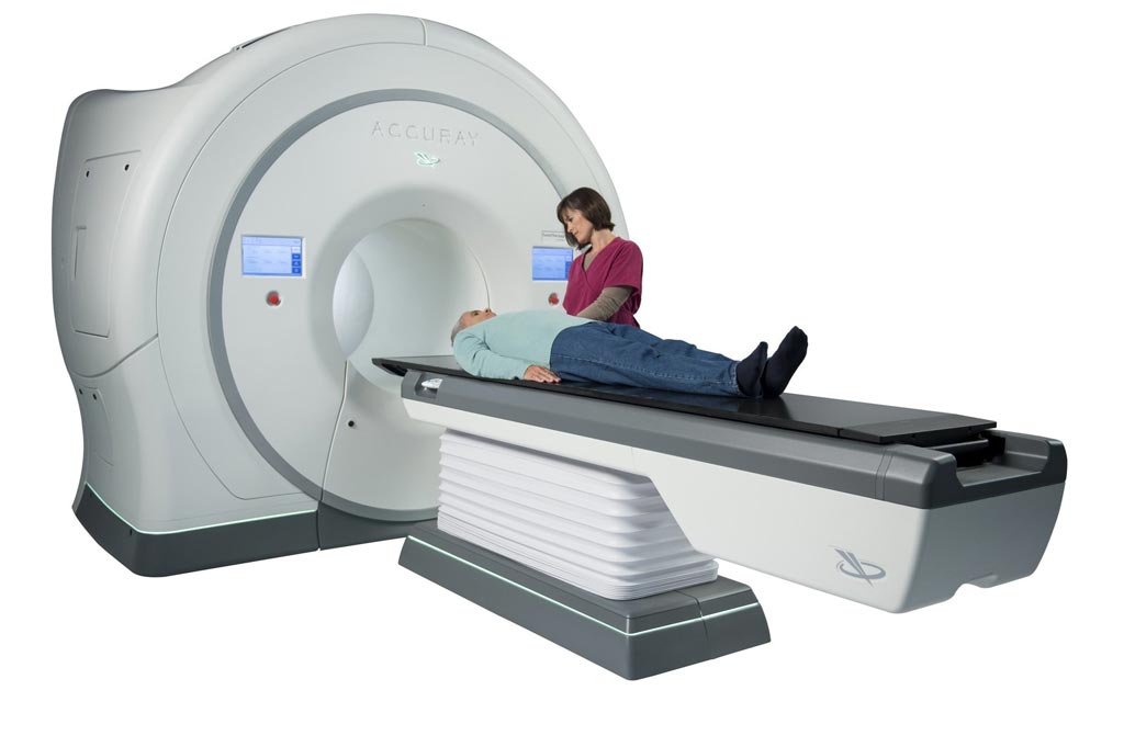 Image: The TomoTherapy system being used to treat a patient (Photo courtesy of Accuray).