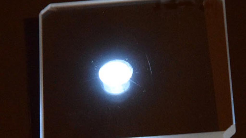 Image: A hackmanite under UV light (Photo courtesy of University of Turku).