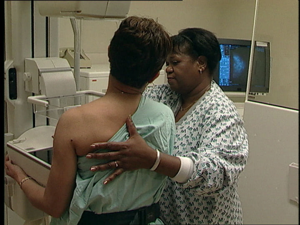 Image: Woman with radiologic technologist during screening mammography exam (Photo courtesy of American Cancer Society)