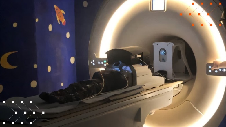 Image: The new eye tracking technology enables young children to engage in an immersive VR experience while undergoing MRI (Photo courtesy of KCL)