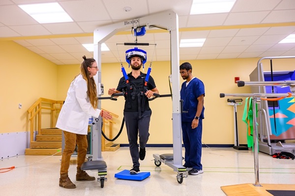 Image: The upright neuroimaging device is expected to expand the ability to research the brain in motion (Photo courtesy of Davidson Chan/WVU)