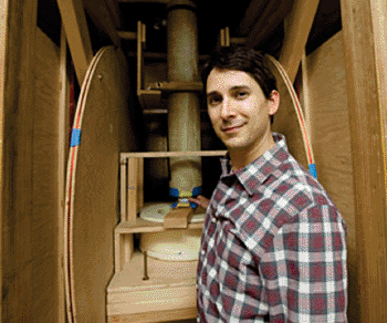 Image: NIST physicist Michael Boss positions a prototype NIST phantom in an ultralow-field magnetic resonance imaging scanner at the University of California at Berkeley. NIST phantoms are intended to help assess and validate this experimental imaging method, which offers advantages in diagnosing and monitoring of certain medical conditions (Photo courtesy of NIST).